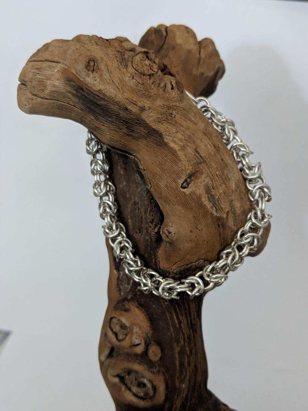 Byzantine chain bracelet displayed on wood